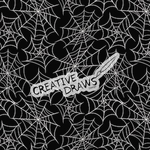 May include: A repeating pattern of white spider webs on a solid black background. Centered in the image is a white graphic element containing the text "CREATIVE DRAWS Design" with a paintbrush icon integrated into the lettering.