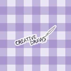 May include: A purple and white gingham background with a white sticker that says "Creative Draws Design" with a hand-drawn paintbrush above the text.