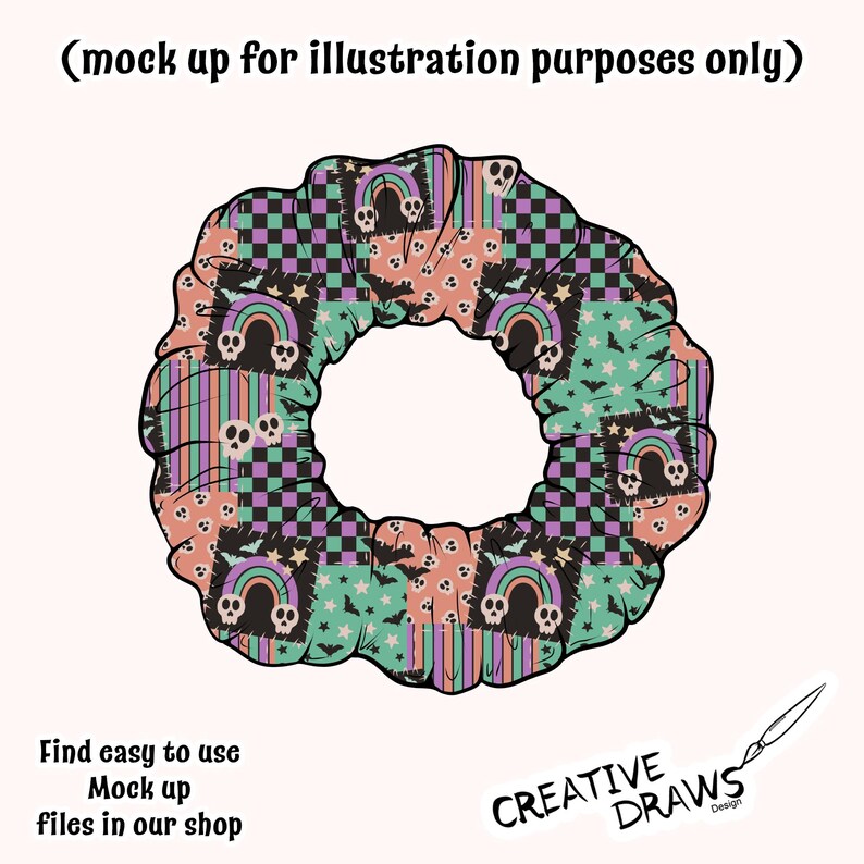 Op de afbeelding: Een kleurrijke scrunchie met een patchwork ontwerp met schedels, regenbogen, sterren en vleermuizen. De scrunchie heeft een mix van kleuren waaronder perzik, teal, paars en zwart. De tekst "Find easy to use Mock up files in our shop" is ook zichtbaar.