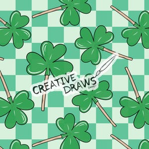 May include: A seamless pattern featuring green four-leaf clovers on sticks against a checkered background of green and white squares. The text "CREATIVE DRAWS Design" is written in white on a black background.