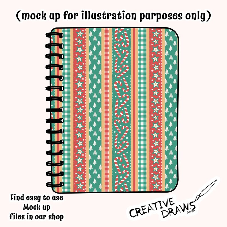 Op de afbeelding: Een spiraalgebonden notitieboek met een kerstthema. Het ontwerp heeft verticale strepen in groen, rood en cr&egrave;me, versierd met zuurstokken, sterren en kerstbomen. De tekst "Find easy to use Mock up files in our shop" is zichtbaar.