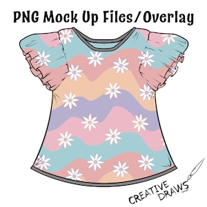 Puede incluir: Una camisa a rayas rosa, azul y naranja con flores blancas de margarita. La camisa tiene mangas con volantes y un escote redondo.