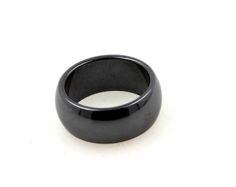 May include: A black hematite ring with a smooth, polished finish.