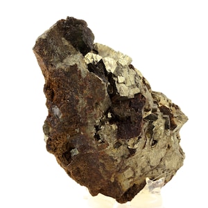 May include: A natural pyrite specimen with a rough, textured surface. The mineral displays a mix of metallic gold and dark brown hues. The pyrite crystals have a cubic structure, and the overall appearance is rugged and earthy.