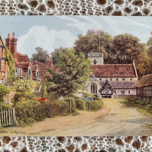 May include: A vintage postcard depicting a quaint English village scene. The postcard features a church with a stone tower, surrounded by lush greenery and charming cottages. The text on the postcard reads "Betchworth, Nr. Reigate".