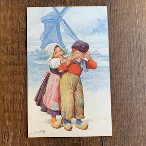 Carte postale ancienne d'enfants néerlandais. Carte postale hollandaise de 1909. Fille et garçon néerlandais. H Feiertag. Pays-Bas Art. C W Faulker. PC297