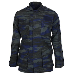 May include: A blue and green camouflage military jacket with a button-up front and multiple pockets.
