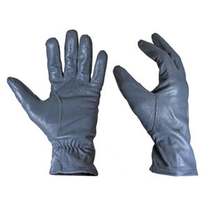 May include: A pair of grey leather gloves with a textured surface. The gloves are shown with the palms facing out.