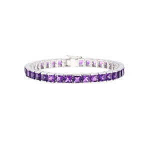 May include: A silver bracelet with a row of square-cut, vivid purple gemstones. The bracelet has a classic design with a secure clasp. The gemstones are evenly spaced, creating a continuous line of colour.