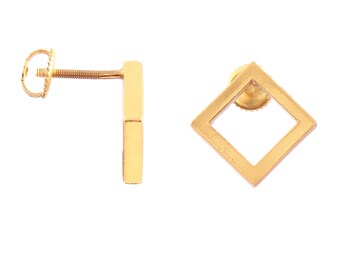 May include: A pair of gold earrings, one is a simple square shape and the other is a long, thin rectangle.