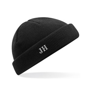 May include: Black beanie with a white embroidered "JH" on the front.