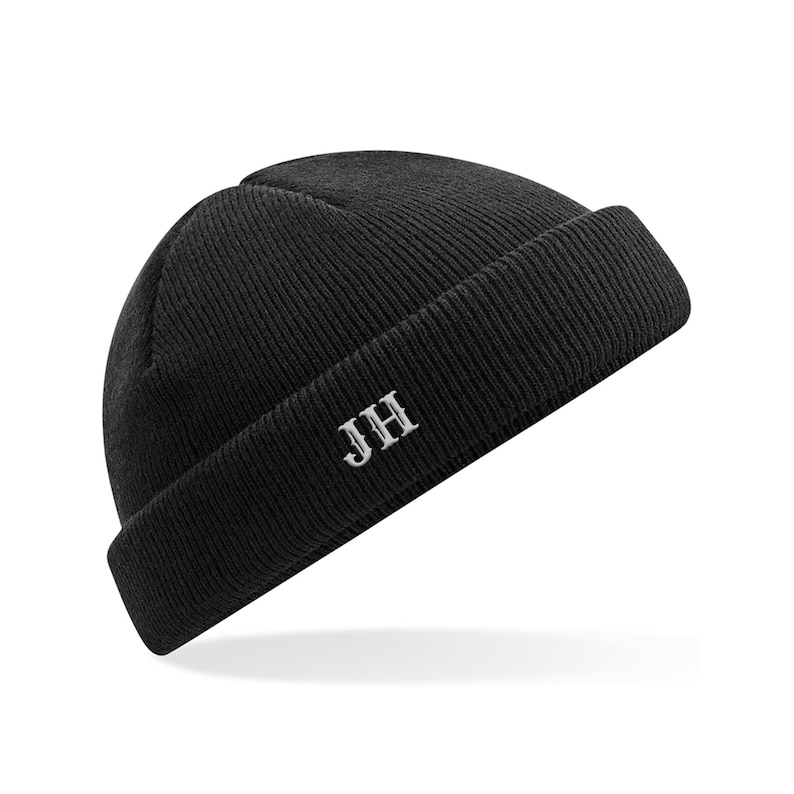 May include: Black beanie with a white embroidered "JH" on the front.