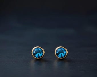 Natural London Blue Topaz Studs - Faceted Round Gems in Solid Gold, Timeless Sparkle