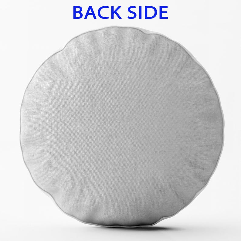 May include: A round, light gray cushion with a scalloped edge. The text "BACK SIDE" is printed in blue at the top. The cushion has a textured appearance.
