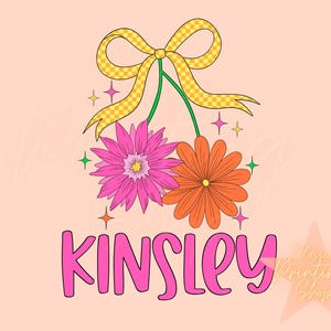 May include: Pink and orange flowers with a yellow bow and the name Kinsley in pink letters. The background is a light peach color.