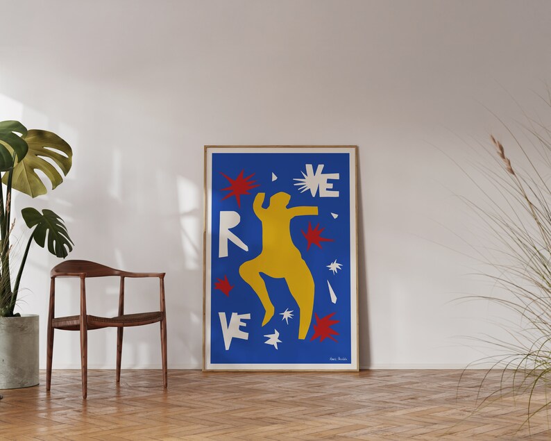 May include: A blue poster with a yellow figure dancing with red and white stars. The poster has the word "REVE" in white letters.