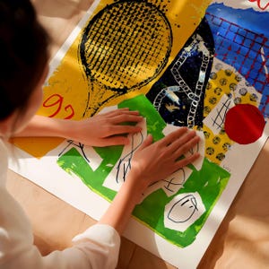 May include: An abstract art print with a tennis racket design, geometric shapes, and the number "92". The artwork uses yellow, green, blue, and red colours. The print is on a white background.
