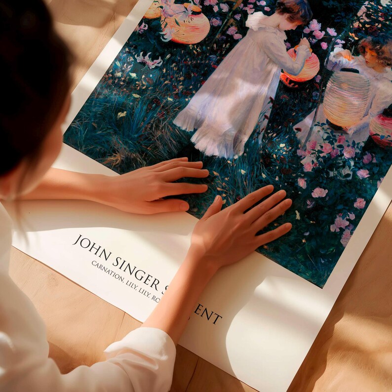 May include: A rectangular art print featuring the painting Carnation, Lily, Lily, Rose by John Singer Sargent. The image depicts two figures in white dresses lighting paper lanterns in a garden filled with pink flowers and deep green foliage.
