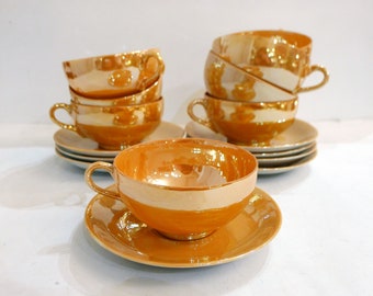 Set of 8 coffee cups with saucer, in iridescent orange porcelain
