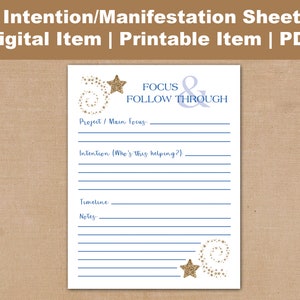 May include: A white printable intention and manifestation sheet with blue lines and text. The sheet includes the text "FOCUS & FOLLOW THROUGH" and prompts for project focus, intention, timeline, and notes. Gold glitter star accents are present.