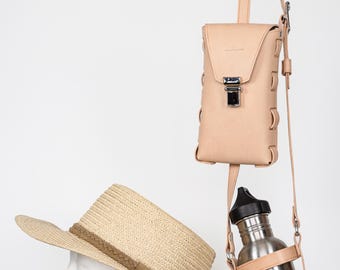 Handgemaakte leren bidonhouder met telefoonzakje