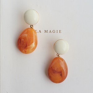 Marbled orange resin pebble earrings