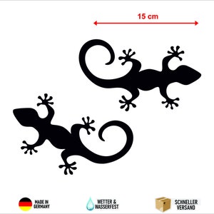 Könnte beinhalten: Zwei schwarze Silhouetten von Geckos mit eingerollten Schwänzen, 9 cm hoch und 15 cm breit.