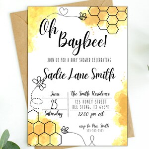 May include: A yellow and white baby shower invitation featuring a bee and honeycomb design. The text reads "Oh Baybee!" and "Join us for a baby shower celebrating Sadie Lane Smith". The date, time, and location are also provided.
