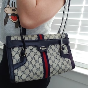 Bolso de mano tipo cartera con monograma GG de Gucci, estilo vintage, con diseño de Sherry Web y diseño Ophidia