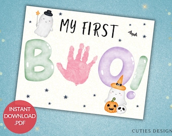 May include: A printable Halloween handprint craft for babies. The design features the word "BOO!" with a ghost, a pumpkin, and a skull. The letters are in pastel colors and have a watercolor effect. The text "My First BOO!" is at the top of the page.
