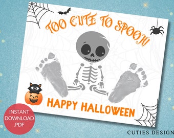 May include: A printable Halloween footprint art design featuring a cute skeleton with the text "Too Cute To Spook! Happy Halloween".