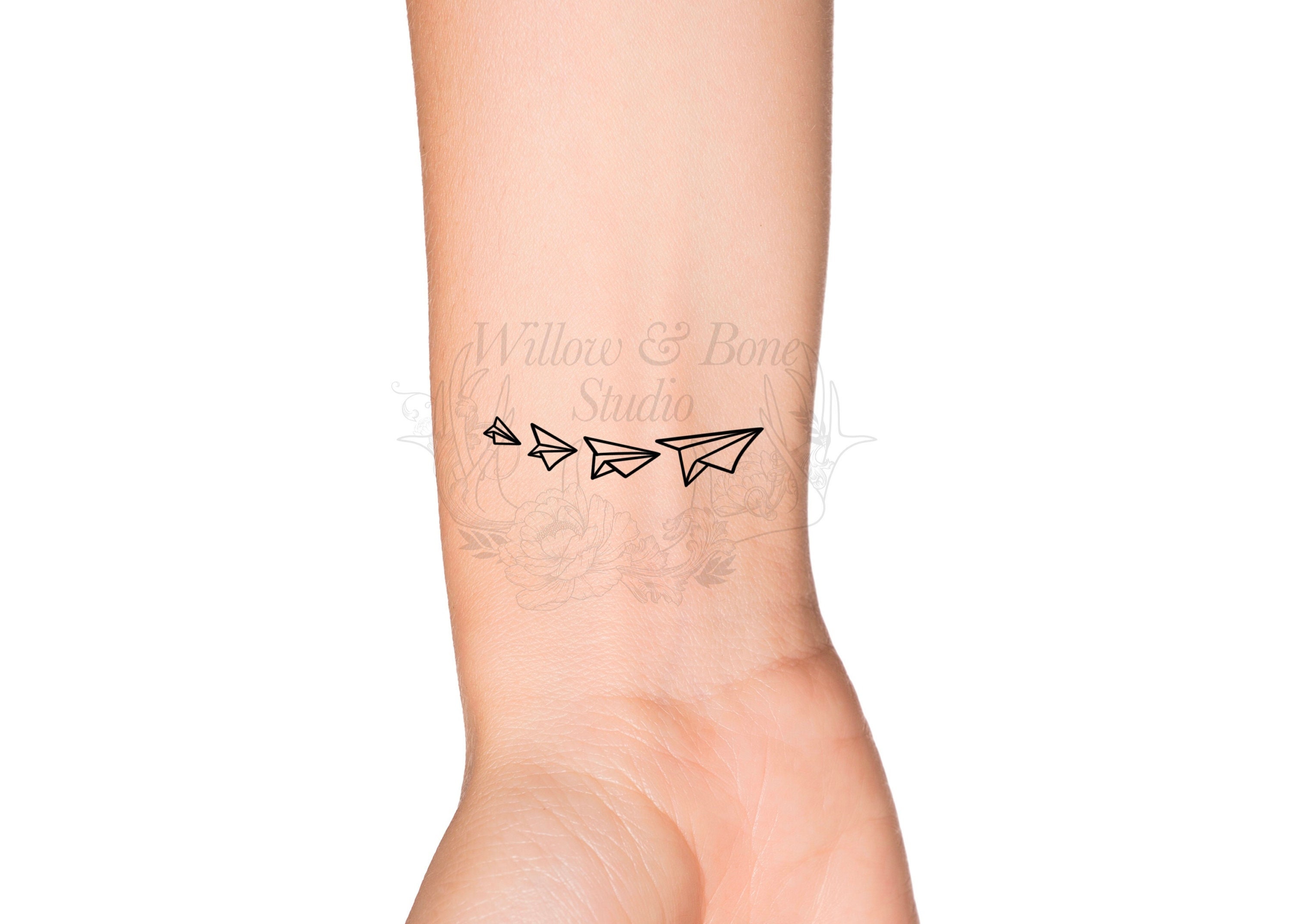 Black Poison Tattoo Studio - A tiny airplane tattoo that is drawn on the  wrist looks good on anyone. You don't have to worry about the kind of  accessories that go well