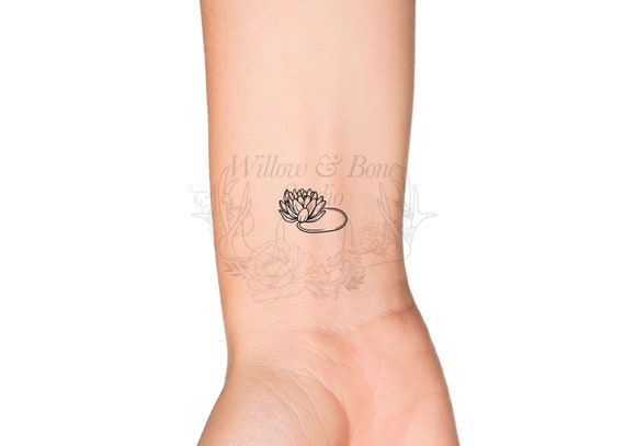 Water Lily Tattoos Mesmerizing Symbols of Purity and Modesty  Thoughtful  Tattoos