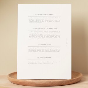 May include: A document with a section titled "Satisfaction Guarantee" and another section titled "Photos/Videos for Marketing". The document also includes sections titled "Force Majeure" and "Governing Law".