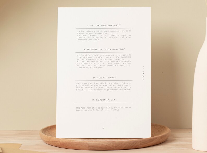May include: A document with a section titled "Satisfaction Guarantee" and another section titled "Photos/Videos for Marketing". The document also includes sections titled "Force Majeure" and "Governing Law".