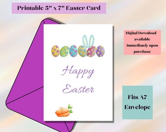 Pode incluir: Cartão de Páscoa imprimível de 12,7 x 17,8 cm com uma fileira de ovos de Páscoa coloridos e um coelho. O cartão diz "Feliz Páscoa" e tem uma ilustração de cenoura. O cartão é projetado para caber em um envelope A7 padrão.