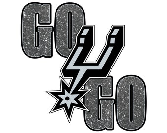 May include: A silver and black graphic with the words "Go Spurs Go" and a stylized silver spur with a star.