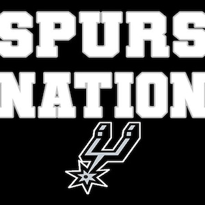 May include: A black background featuring the words "SPURS NATION" in white with grey outlines. The Spurs logo, a silver spur with a lightning bolt and star, is positioned below the text.