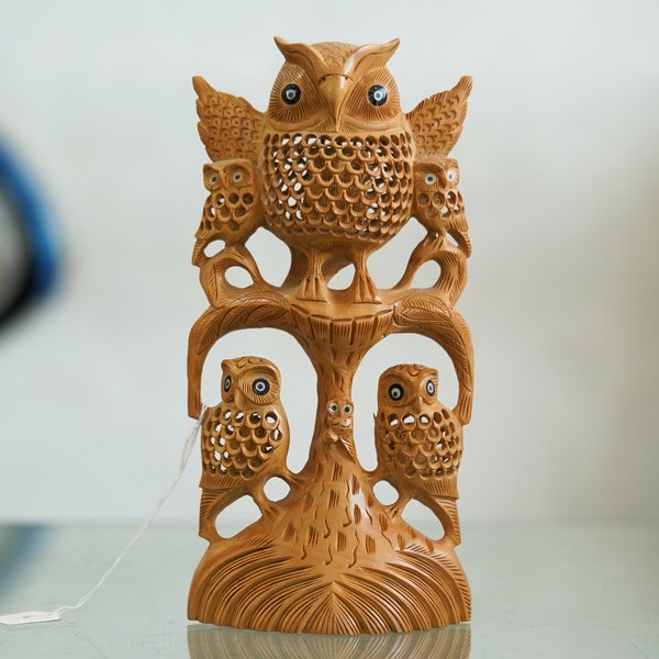 Harmonious Wooden Owl Family Sculpture: Crafted Elegance Depicting Unity and Wisdom in Nature's Embrace.