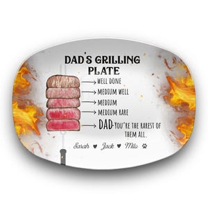 May include: Oval grilling plate with text "DAD'S GRILLING PLATE" and a diagram of steak doneness levels. The plate features flames and the text "DAD - You're the rarest of them all." Names and a paw print are at the bottom.