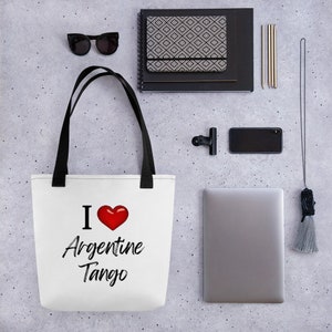 May include: White tote bag with black handles and the text "I love Argentine Tango" in black with a red heart.