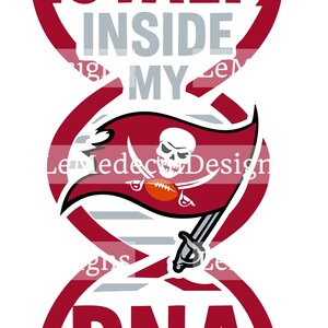 May include: A graphic design featuring the words "LOYALTY INSIDE MY DNA" in a red, stylized font. The design incorporates a DNA strand with a pirate flag emblem, including a skull, crossed swords, and a football.