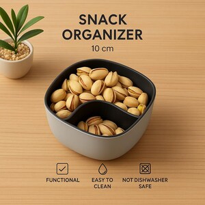 Könnte beinhalten: Ein grauer und schwarzer Snack-Organizer, 10 cm breit, gefüllt mit Pistazien. Der Behälter hat zwei Fächer. Der Text auf dem Bild lautet "SNACK ORGANIZER", "FUNCTIONAL", "EASY TO CLEAN" und "NOT DISHWASHER SAFE".