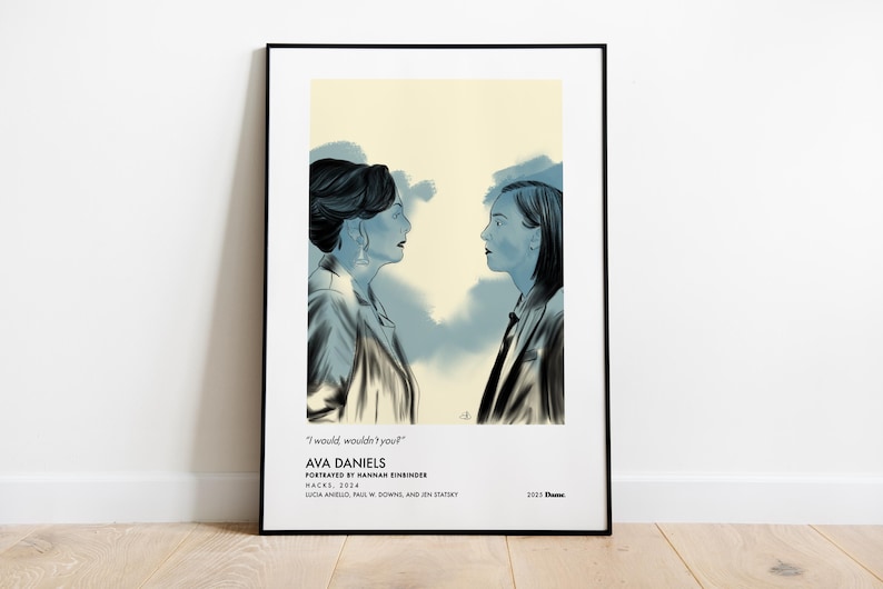 May include: Framed art print featuring a blue and white illustration of two women facing each other. The artwork includes the text "I would wouldn't you?" and "AVA DANIELS" with additional text below. The print is displayed on a white wall.