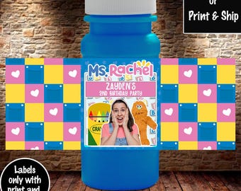 May include: Blue bubble bottle with a label featuring a photo of a girl and a furry character. The label also includes the text "Ms. Rachel", "Zayden's", "2nd Birthday Party", and "CRA".