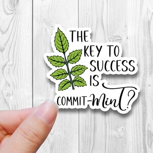 May include: White sticker with a green leaf design and the text "The key to success is commit-mint?"