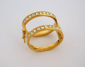 Collar vintage JOAN RIVERS con colgante de torsade de cristal transparente en tono dorado.