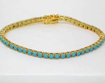 Pulsera de tenis vintage JOAN RIVERS con pedrería color turquesa y cierre de 7,75 pulgadas.