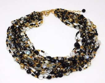 Collar vintage JOAN RIVERS de cuentas de cristal checo negras y doradas de múltiples hebras en forma de torsade.