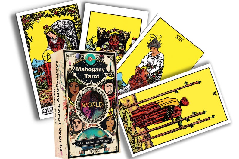 May include: A deck of "Mahogany Tarot" cards with a box featuring the word "WORLD" and illustrations of faces. Several tarot cards are fanned out, each with yellow backgrounds and colorful illustrations. The deck is by Kasheera Hickson.